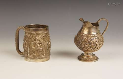 An Indian silver coloured cup, of tapering cylindrical form ...