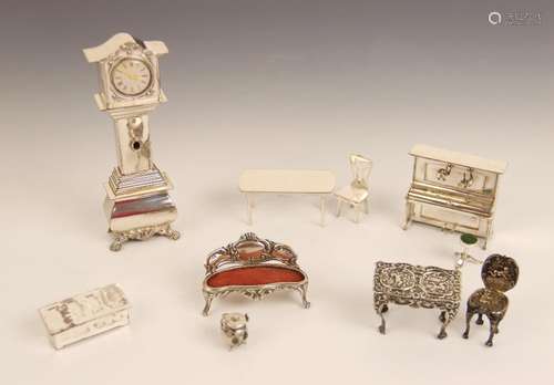 A selection of Dutch silver dolls house furniture, makers ma...