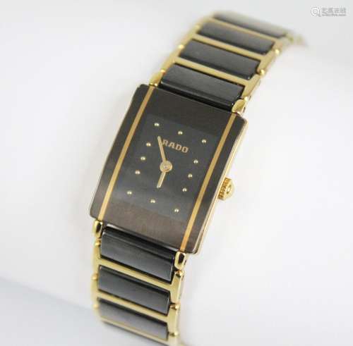 A ladys Rado DiaStar wristwatch, the rectangular lack dial w...