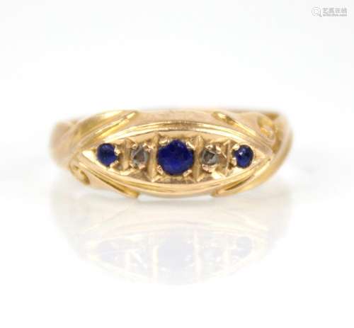 An Edwardian sapphire and diamond 18ct gold ring, the centra...