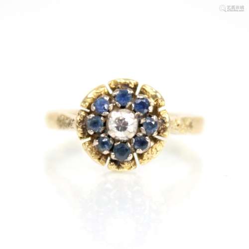 A sapphire and diamond floral cluster ring, the central roun...