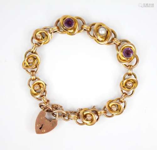An Arts & Crafts gold coloured amethyst and pearl set br...