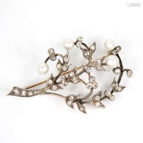 An early 20th century diamond and pearl floral spray brooch,...