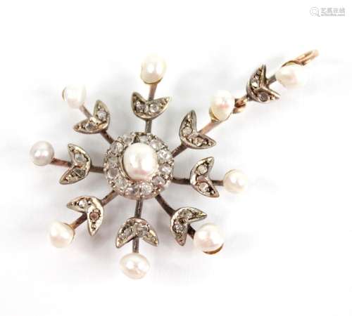 An Edwardian pearl and diamond snowflake pendant, designed a...