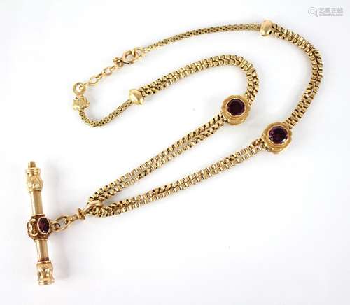 A French 18ct gold garnet set watch key on chain, the double...