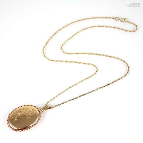 A Clogau 9ct gold locket pendant, the oval shaped locket eng...