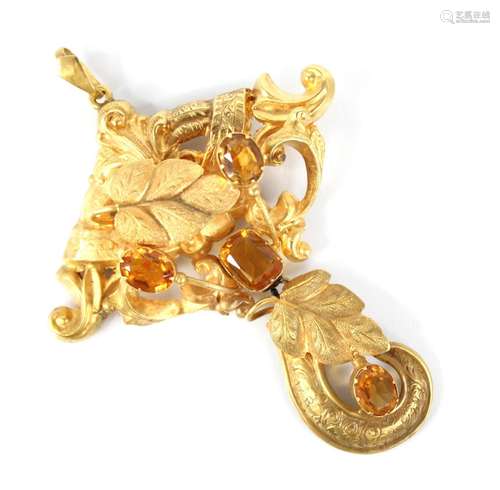 A Victorian citrine set foliate pendant, the scrolling pierc...