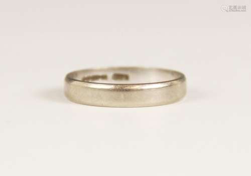 An 18ct white gold wedding band, marks for Birmingham 1979, ...