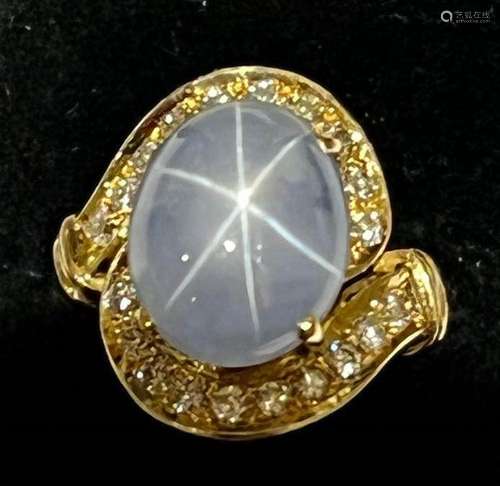 A mid-20th century star sapphire and diamond 18ct gold ring,...