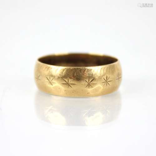 An 18ct wedding band, star cut detail to band, marks for S &...