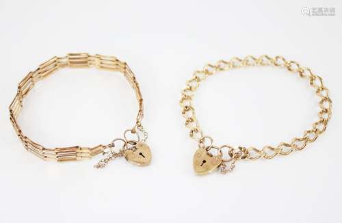 A 9ct gold curb link bracelet, approximately 18cm long, susp...