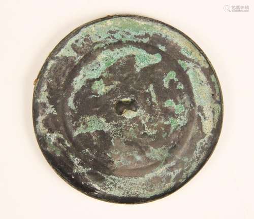 A Chinese bronze mirror, possibly Song Dynasty, of polished ...