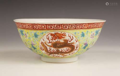 A Chinese porcelain famille jaune dragon bowl, Guangxu (1875...