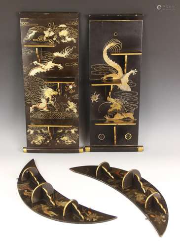 A pair of Chinese lacquered crescent wall shelves, each gilt...