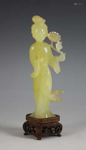 A Chinese jade figure of Lan Caihe, early 20th century, eleg...