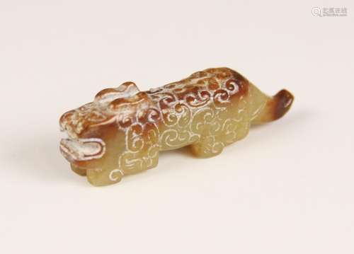 A Chinese carved jade mythical beast, in the Archaic style, ...