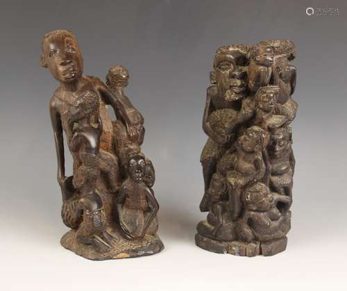 Two Congolese tribal carvings of fertility, each depicting a...