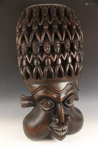 A large Bamileke carving, Cameroon, 20th century, carved dep...