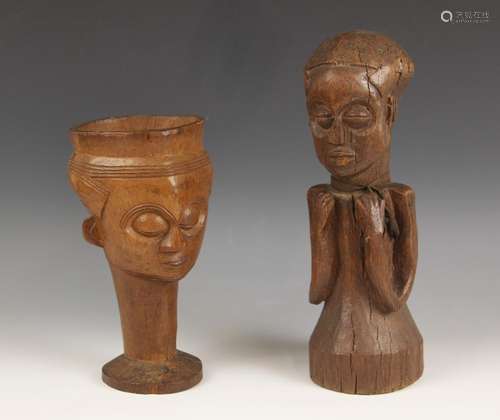 A West African Lele cup, Belgian Congo, carved with a mask, ...