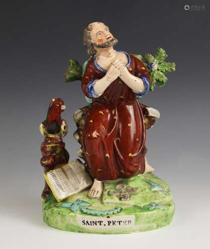 A Staffordshire figure titled Saint Peter, early 19th centur...