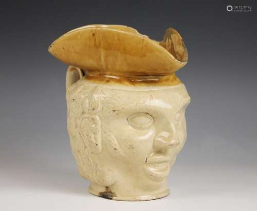 A late 18th or early 19th Century stoneware character jug, t...