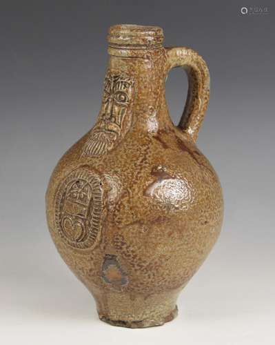 A 17th century Armorial bellarmine jug, the salt glazed ston...