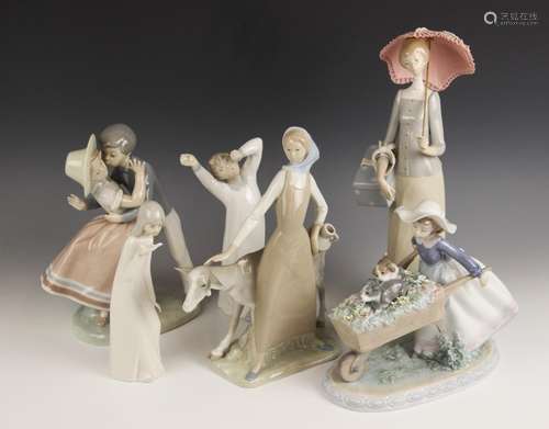 A Lladro Precious Love figural group, modelled as a young bo...