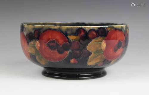 A Moorcroft pomegranate pattern footed bowl, mid 20th centur...