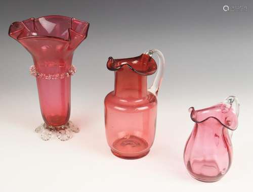 A cranberry glass vase, 19th century, with flared folded rim...