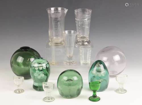 Three Victorian green glass dump paperweights, late 19th cen...