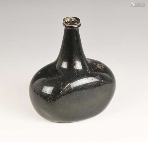 An English 18th century glass wine bottle, of bladder shape ...