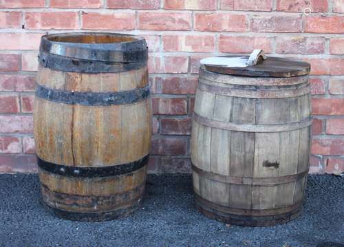 An oak barrel, of typical swelling coopered form with detach...