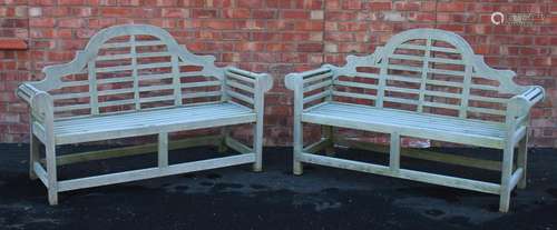 A pair of Lutyens type hardwood benches, late 20th century, ...