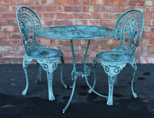 A painted metal patio table and two chairs, 20th century, ea...