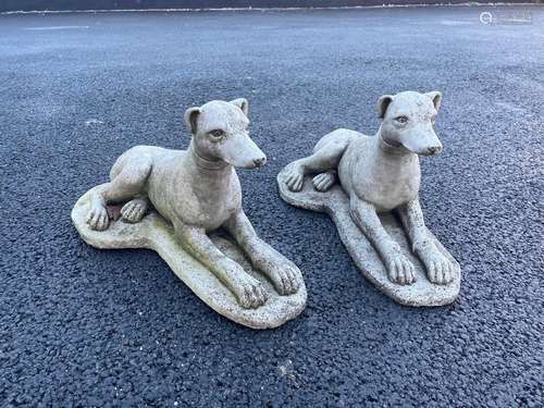 A pair of reconstituted stone garden ornaments, each modelle...