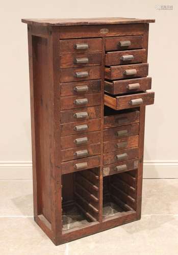 An Ullmer pine printers cabinet, late 19th century, formed f...