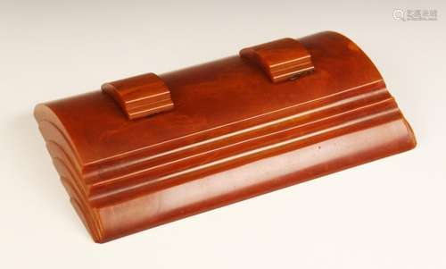 An Art Deco amber Bakelite desk stand (possibly Carvacraft),...