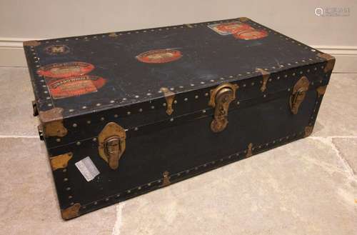 An early 20th century steamer trunk, bearing multiple Cunard...