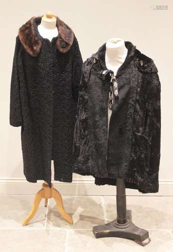 A mid 20th century black astrakhan type faux fur coat, with ...