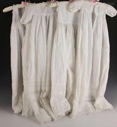 Four early 20th century christening gowns, in fine white cot...