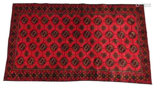 An Afghan Belouch wool rug, the forty four octagonal medalli...