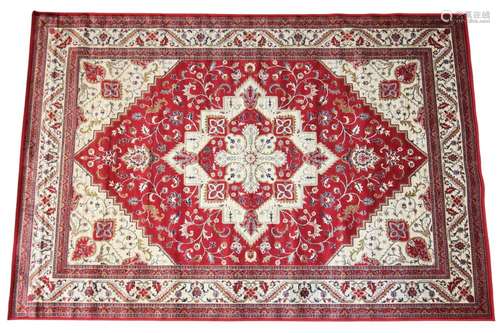 A vibrant red ground Kashmir rug, the traditional medallion ...