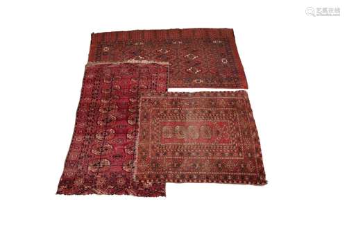 Three Bokhara type rugs, each in red and black colourways wi...