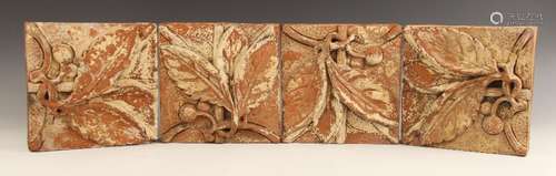 Four high relief moulded terracotta tiles, 19th century, eac...