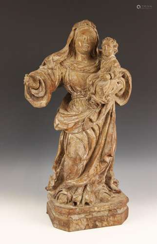 An Italian Baroque style limewood carving of The Madonna and...