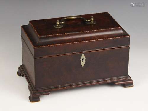 A George II mahogany tea caddy, the hinged pagoda cover with...