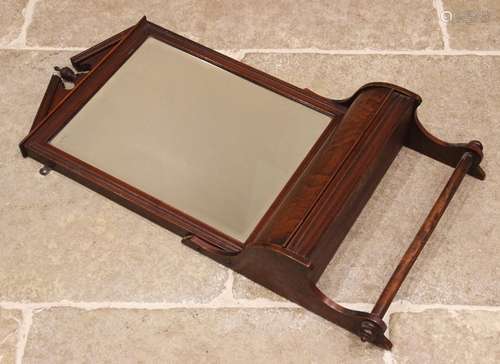 An Edwardian walnut framed toilet mirror, the bevelled recta...