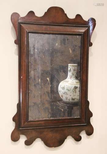 A William and Mary style walnut framed wall mirror, the rect...