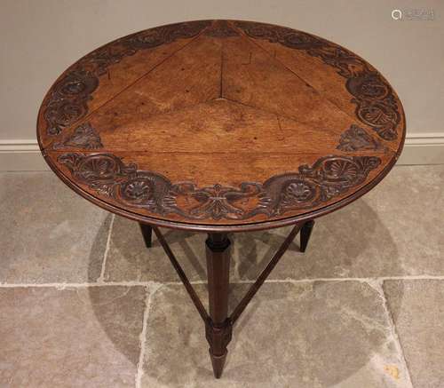 A 17th century style oak triform drop leaf occasional table,...