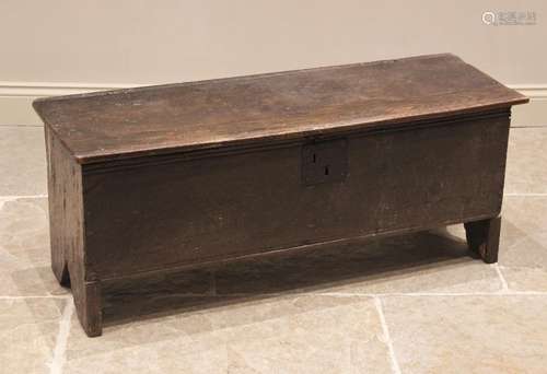 A 17th century and later oak six plank coffer, the hinged pl...